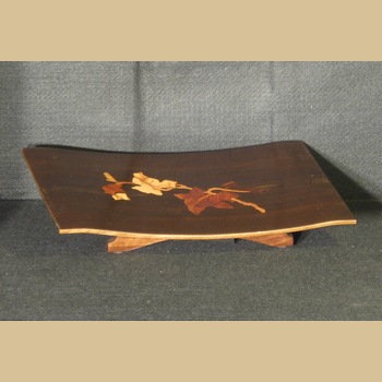 T82- sprig of ivy on ipe wood
